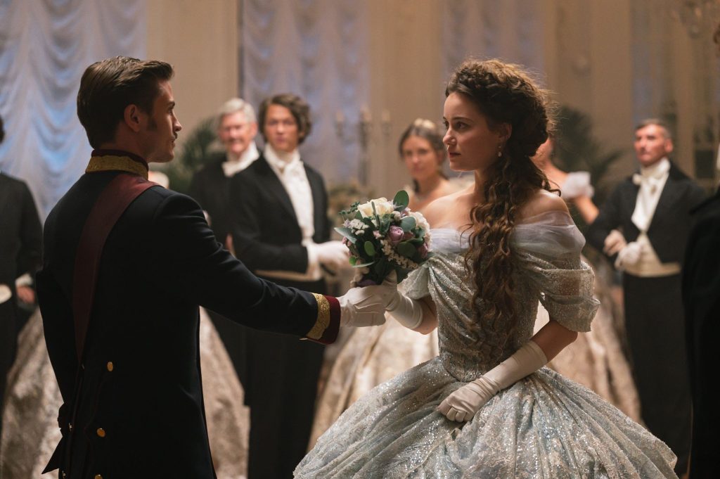 Emperor Franz announces his engagement during an anniversary ball and hands Sisi the engagement bouquet